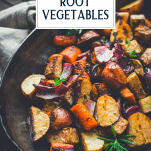 Close up side shot of oven roasted root vegetables with text title overlay