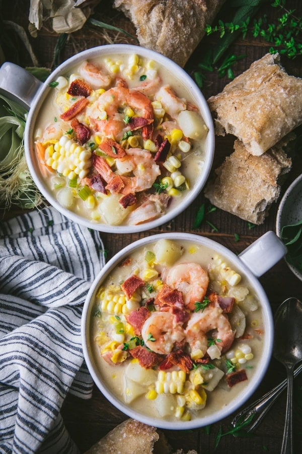 Overhead shot of two bowls of shrimp and corn soup