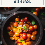 Close overhead shot of cherry tomato salad with text title box at top