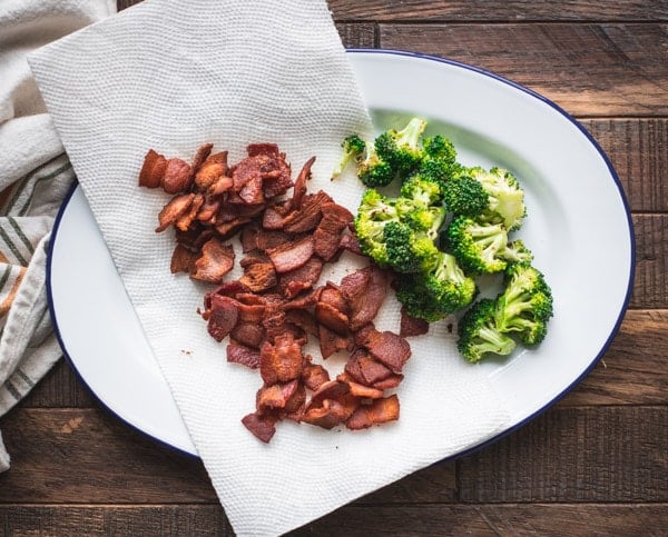 Broccoli and bacon on a plate.