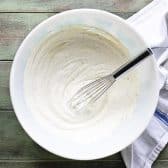 Whisking together the creamy ingredients for corn dip.
