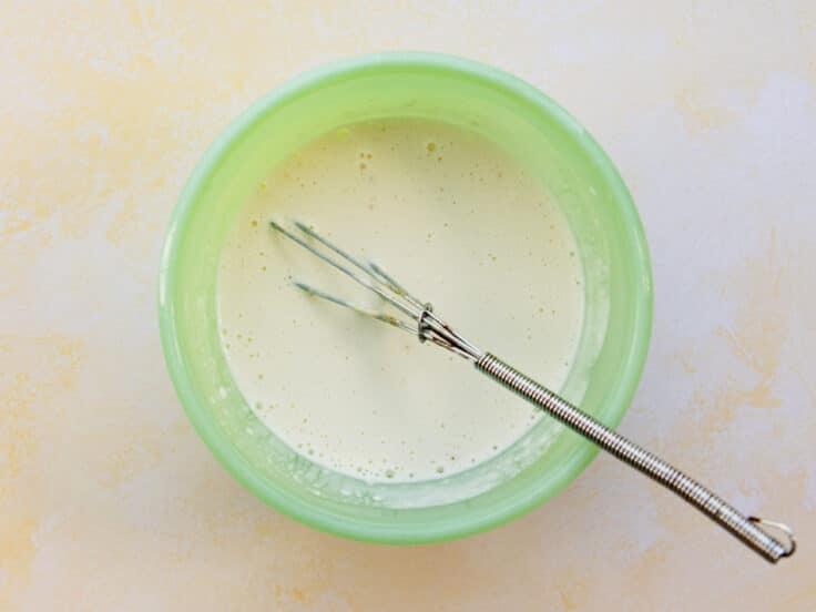Whisking together a creamy dressing for a summer corn salad.