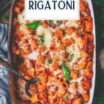 Overhead shot of a pan of baked rigatoni with text title overlay