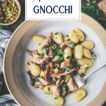 Overhead image of a bowl of chicken gnocchi with text title overlay