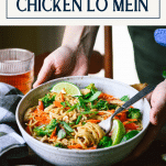 Hands serving a bowl of easy chicken lo mein recipe with text title box at top