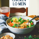Side shot of a bowl of homemade chicken lo mein with text title overlay