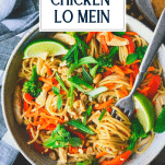 Close overhead shot of chicken lo mein in a bowl with text title overlay