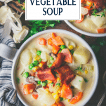 Overhead shot of vegetable and potato chowder with text title overlay