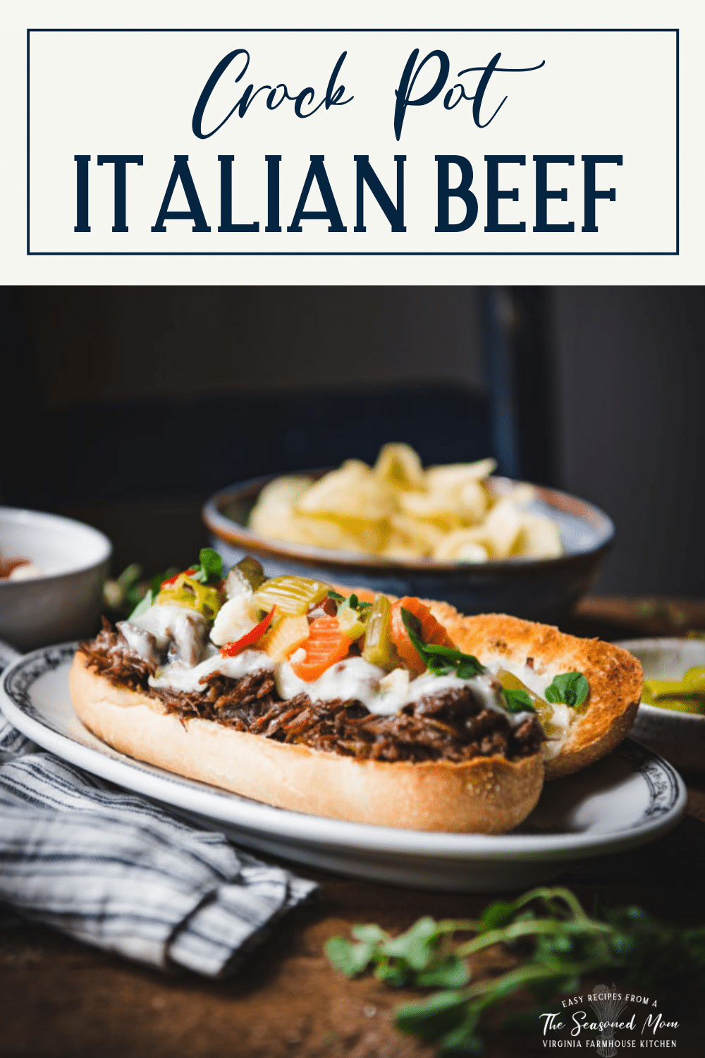Side shot of a plate with a Crock Pot Italian Beef sandwich recipe with text title box at top