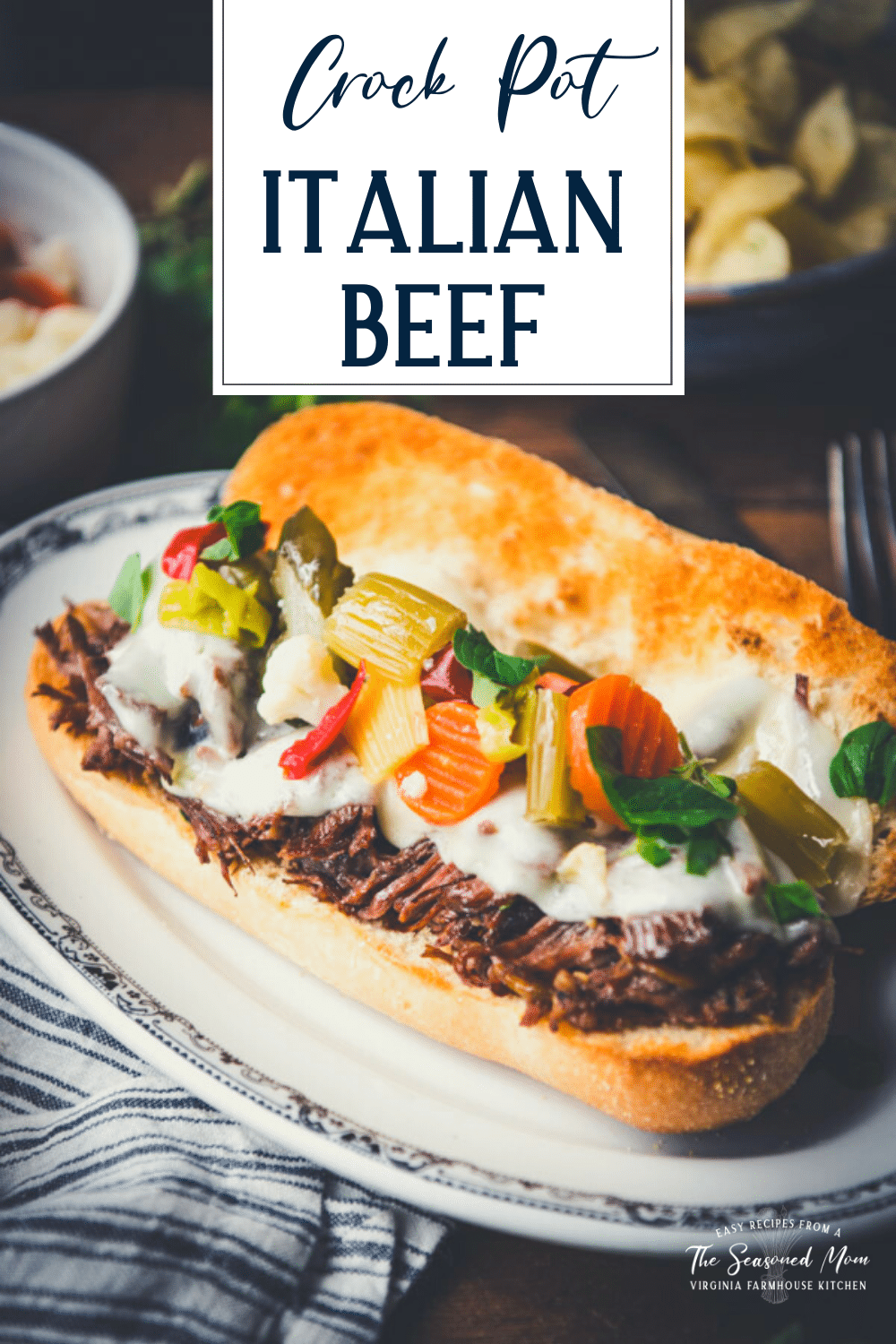 Close up shot of easy Italian Beef recipe served on hoagie rolls with text title overlay