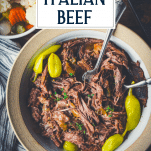 Overhead bowl of shredded Italian beef with text title overlay