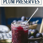 Side shot of a jar of damson plum preserves with text title box at top