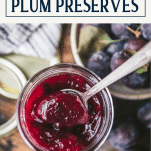 Overhead image of damson plum preserves in a jar with text title box at top