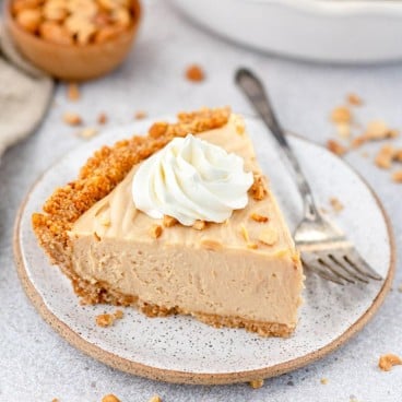 Square image of a slice of peanut butter pie