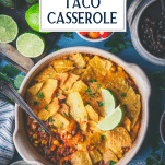Overhead image of taco casserole on a blue table with text title overlay