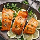 Horizontal overhead shot of Dijon mustard salmon with brown sugar glaze in a roasting pan.
