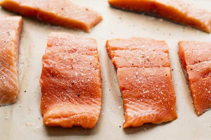 Process shot showing how to make Dijon mustard salmon.