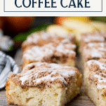 Close up shot of slices of apple crumb coffee cake with text title box at top