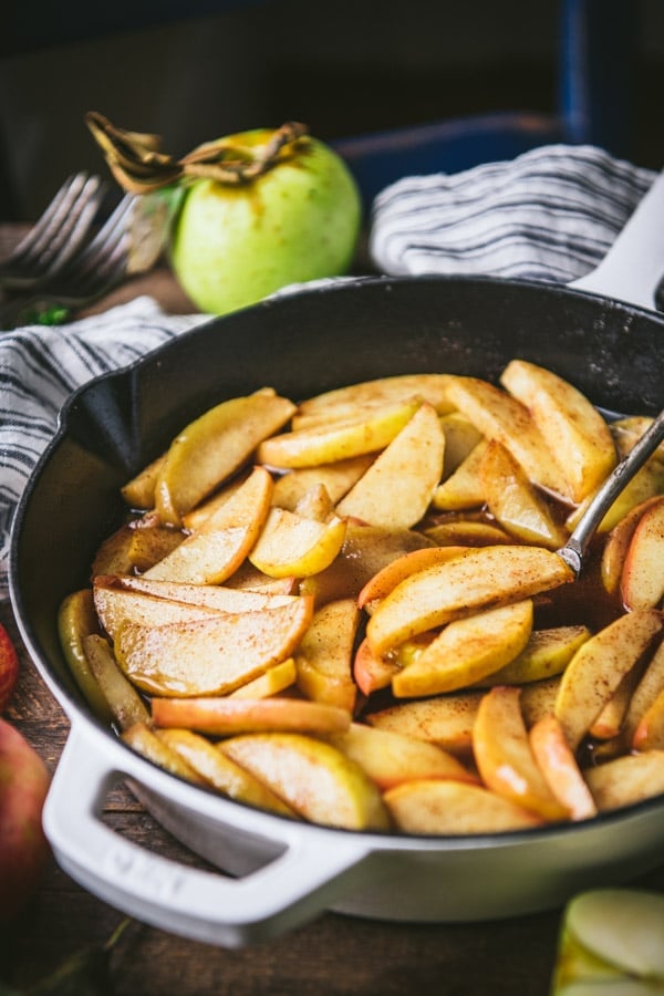 Close up side shot of easy baked apple slices in a cast iron skillet