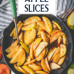 Skillet full of baked apple slices with skin and text title overlay