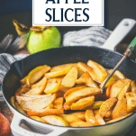 Cast iron skillet full of baked cinnamon apple slices with text title overlay