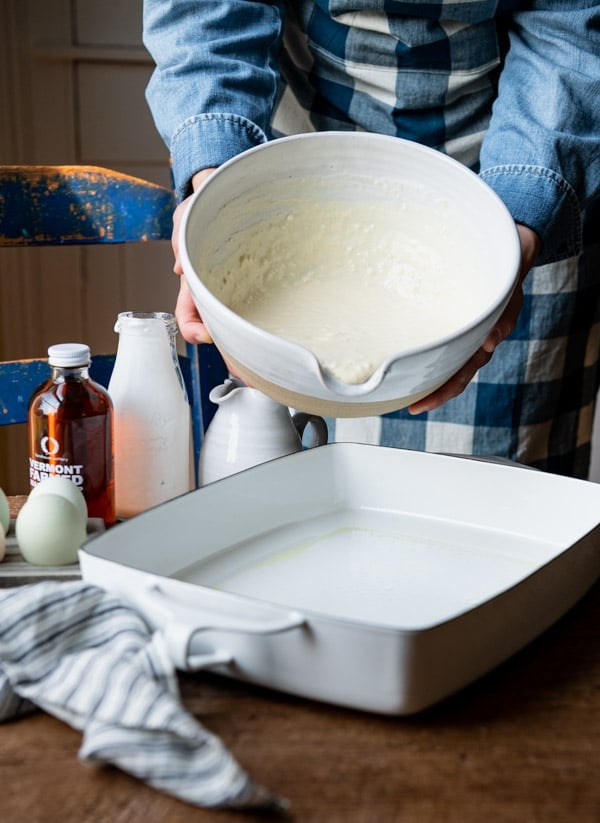 Pouring batter into a white 9 x 13 dish