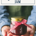 Hands gifting a jar of Christmas Jam with text title box at top