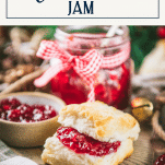 Christmas jam spread on a biscuit with text title box at top