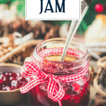 Spoon in a jar of Christmas jam with text title overlay