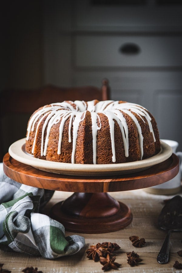Side shot of old fashioned cinnamon coffee cake on a cake stand