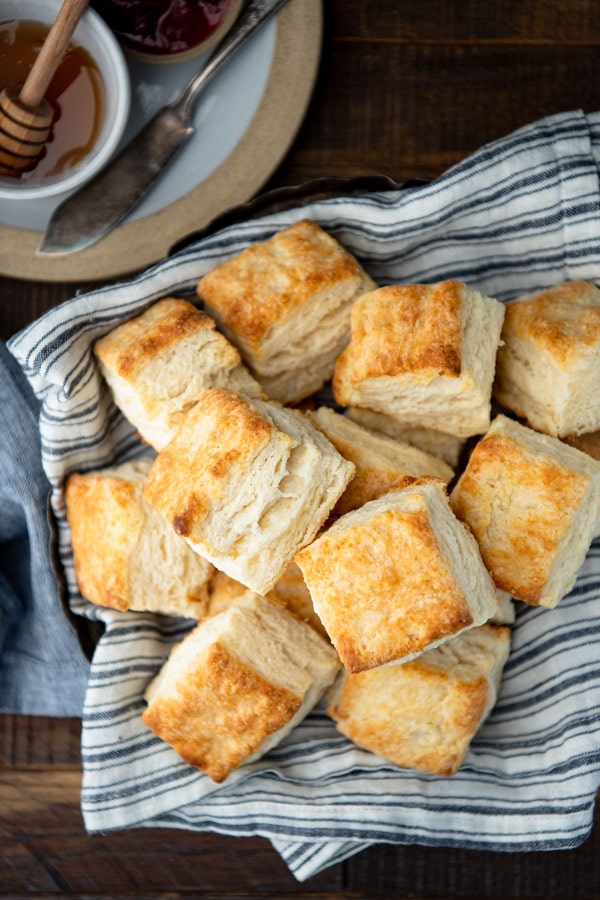 Overhead shot of a basket of homemade buttermilk biscuits