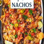 Close overhead shot of pulled pork nachos with text title overlay