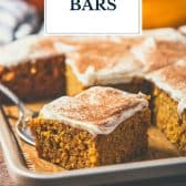 Pumpkin bars with cream cheese frosting and text title overlay.