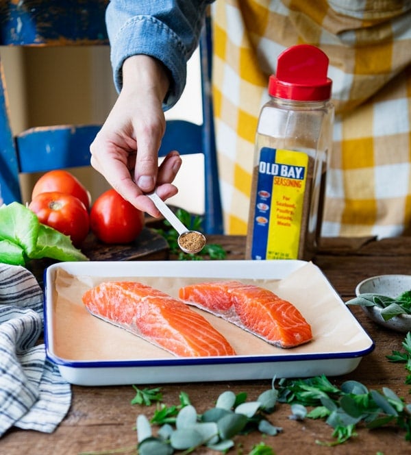 Seasoning salmon fillets with Old Bay