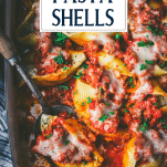Close overhead shot of stuffed pasta shells with text title overlay