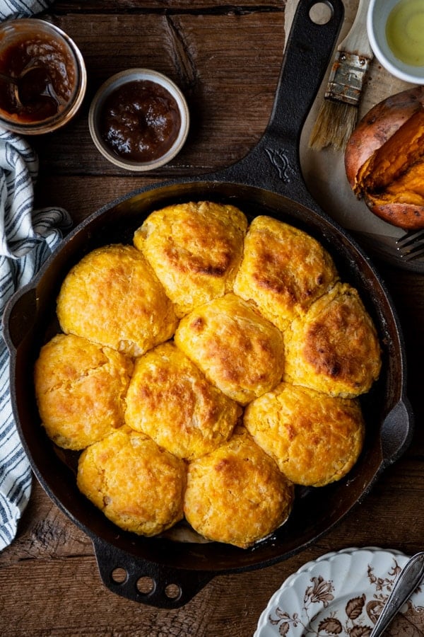 Overhead shot of grandma's sweet potato biscuits in a cast iron skillet