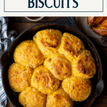 Overhead shot of a skillet of homemade sweet potato buttermilk biscuits with text title box at top