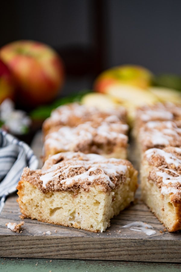 Facet shot of easy apple coffee cake squares on a wood cutting back board  Easy Apple Espresso Cake apple coffee cake 9