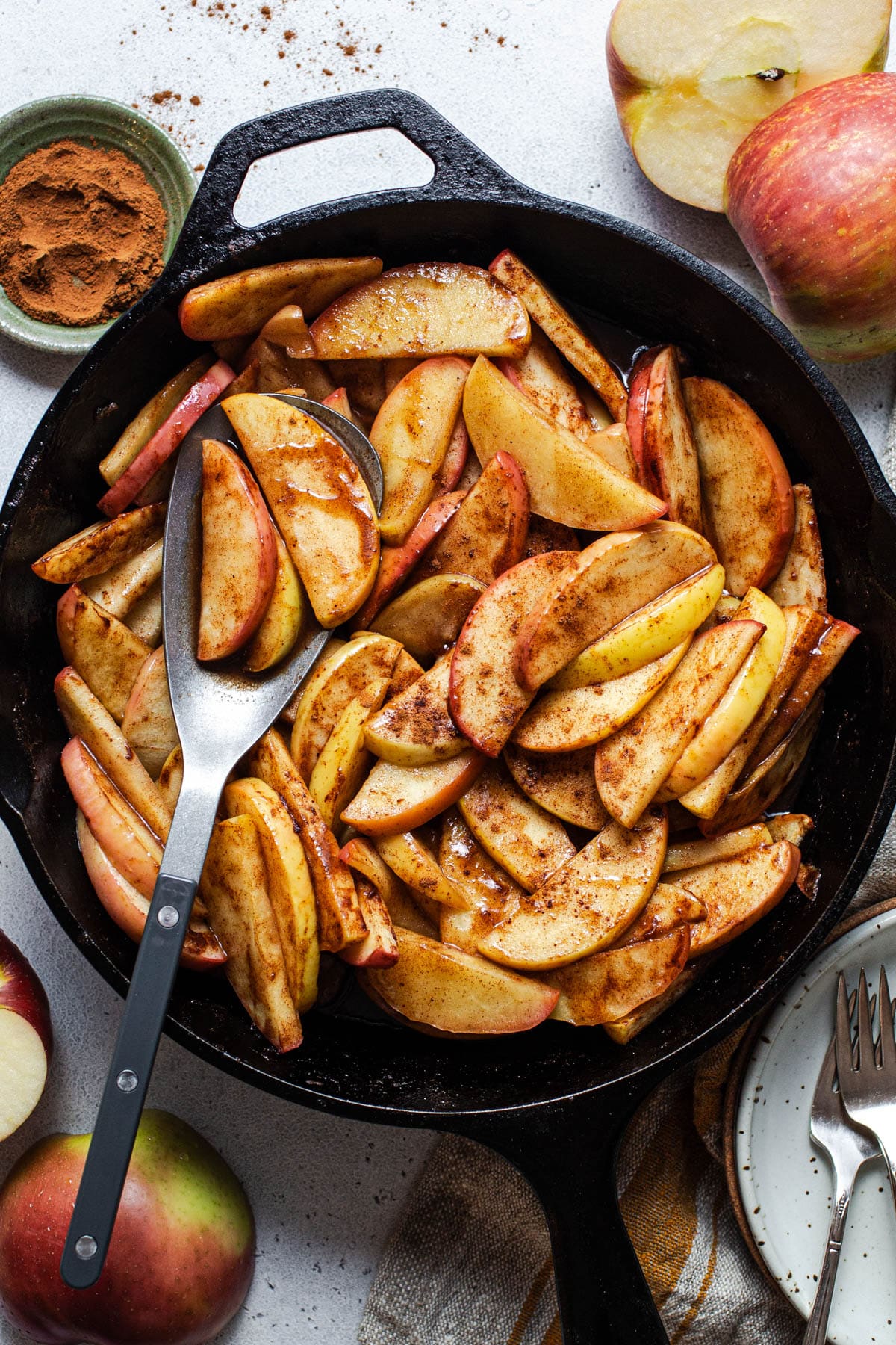 Overhead shot of a skillet of easy baked apple slices.
