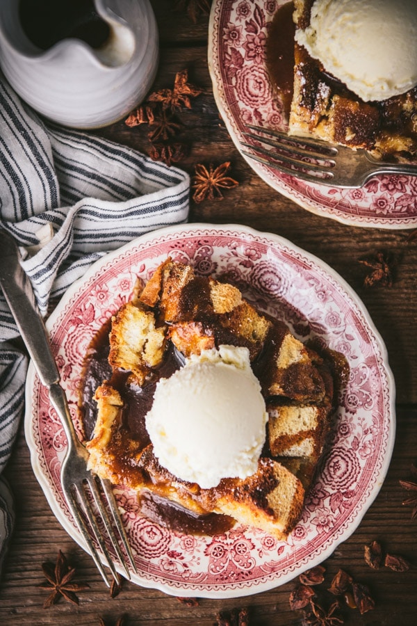 Overhead shot of easy bread pudding recipe served on two small vintage plates.