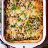 Square overhead shot of a pan of crescent roll ground beef casserole.