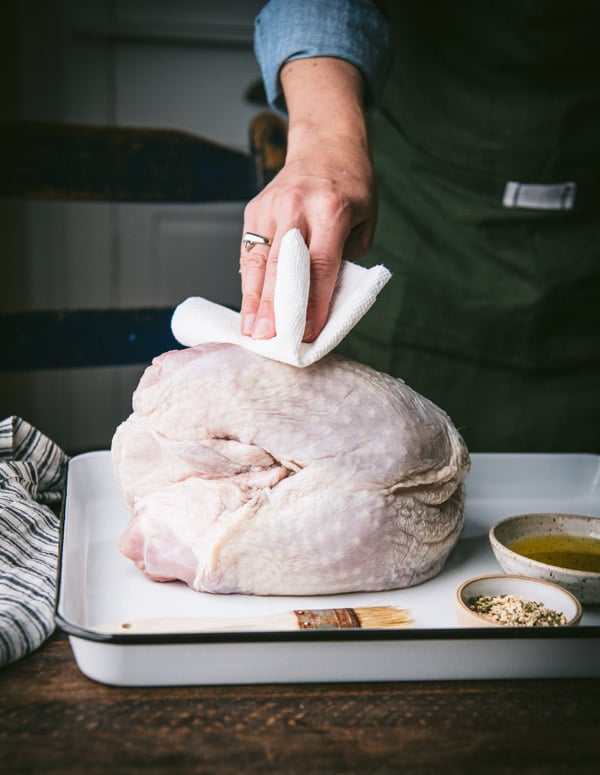 Process shot with step by step instructions showing how to smoke a turkey breast