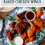 Overhead shot of a tray of the best baked chicken wings recipe with text title box at top