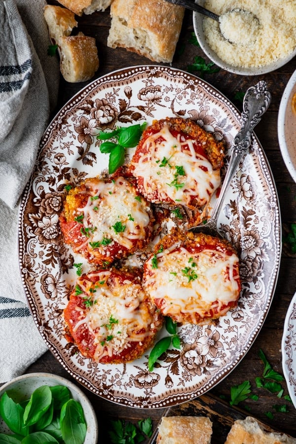 Overhead image of the best eggplant parmesan recipe on a tray on a wooden table.