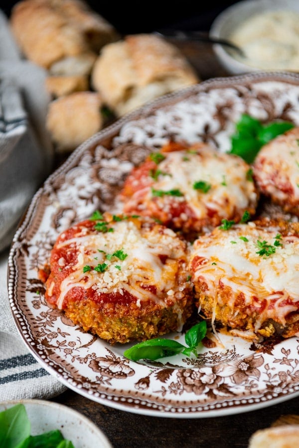 Close up side shot of a tray of the best baked eggplant parmesan recipe.