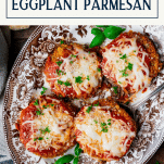 Overhead image of baked eggplant parmesan on a tray with text title box at top.