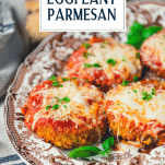 Close up side shot of the best baked eggplant parmesan recipe with text title overlay