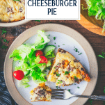 Overhead shot of cheeseburger pie on a plate with text title overlay