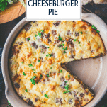 Overhead shot of a round dish full of Bisquick cheeseburger pie with text title overlay