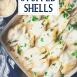 Pan of chicken alfredo stuffed shells with text title overlay